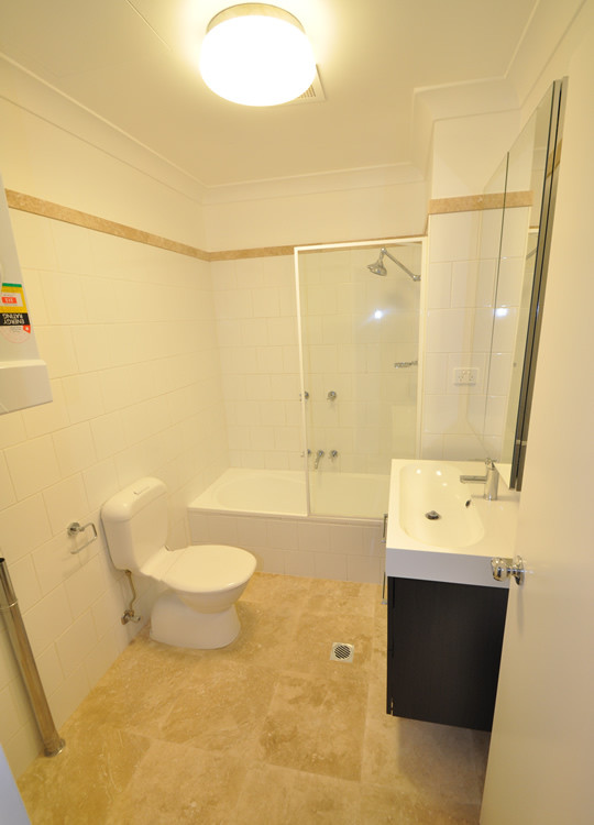 Cooper Bathroom with single sink vanity, shower and toilet